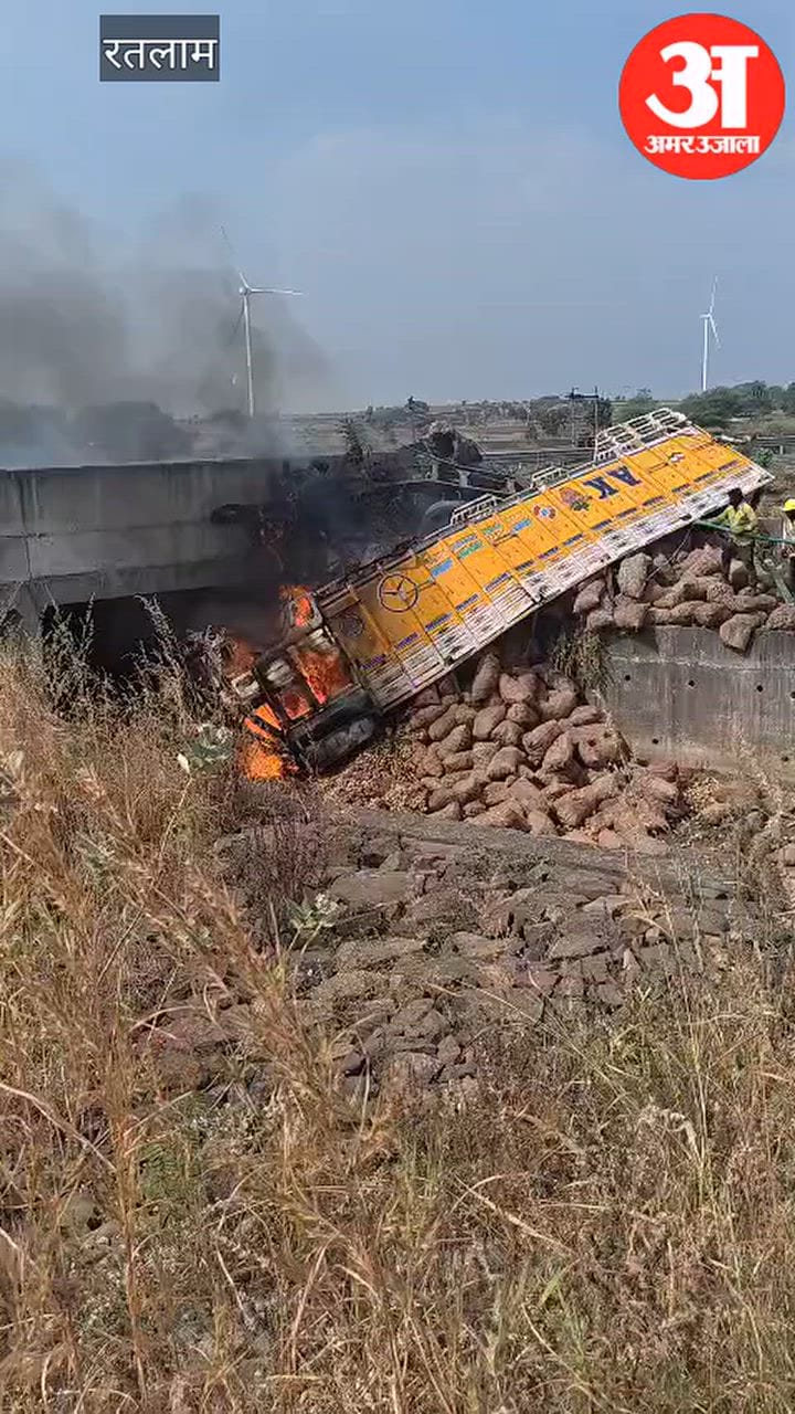 A truck overturned off a culvert on the Delhi-Mumbai Expressway and caught fire; driver-cleaner were injured