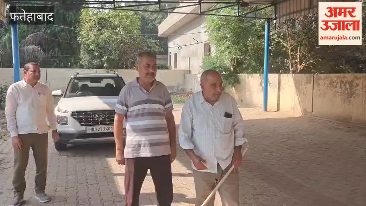 Monkeys stand guard over children's safety at school, while teachers and a councilor stand by, armed with sticks.