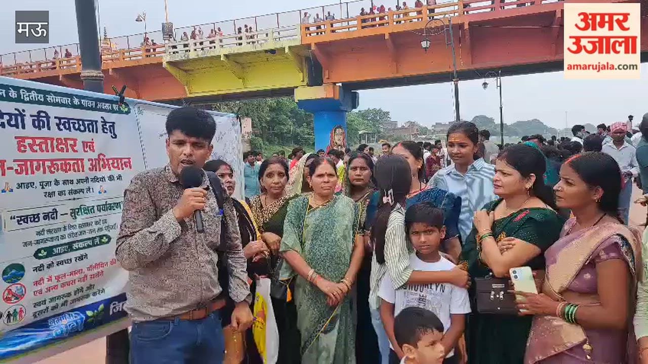 People pledge for cleanliness by signing on the banks of the Tamsa