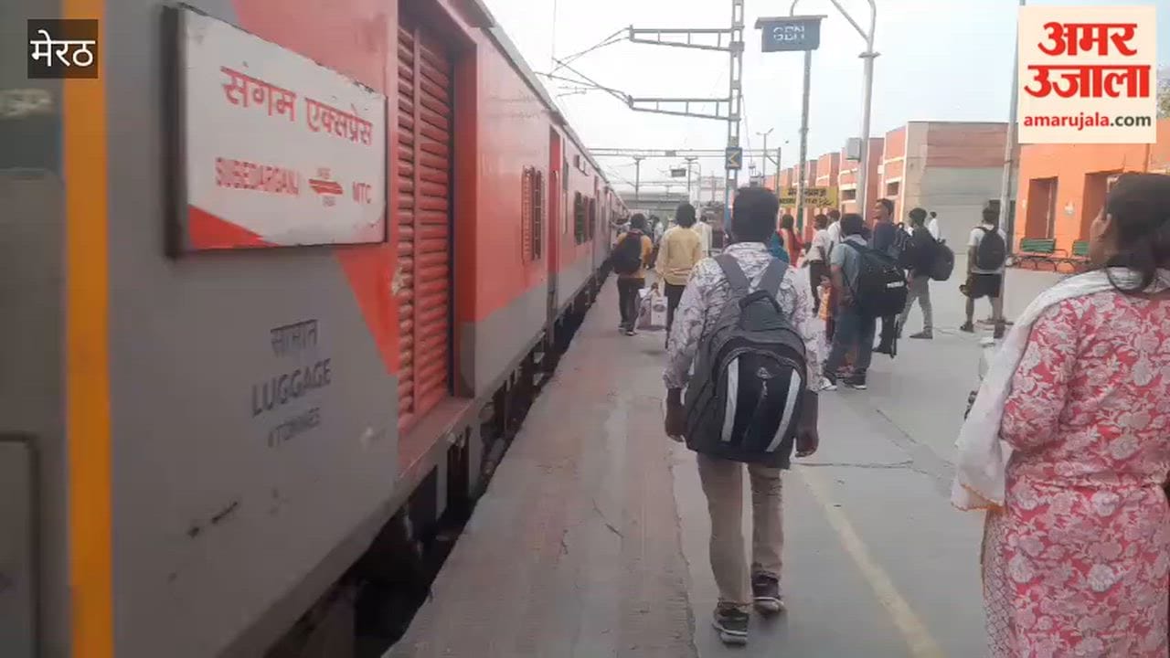 Passengers risking their lives to board a moving train.