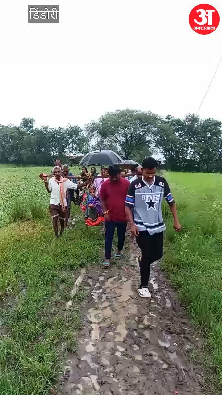 Poor Road Forces Villagers to Carry Elderly Woman on Cot to Hospital
