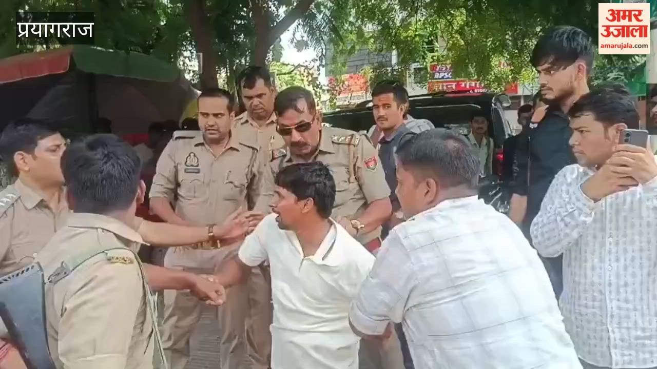 Heated altercation between students and police personnel; protesting agitators forcibly detained.