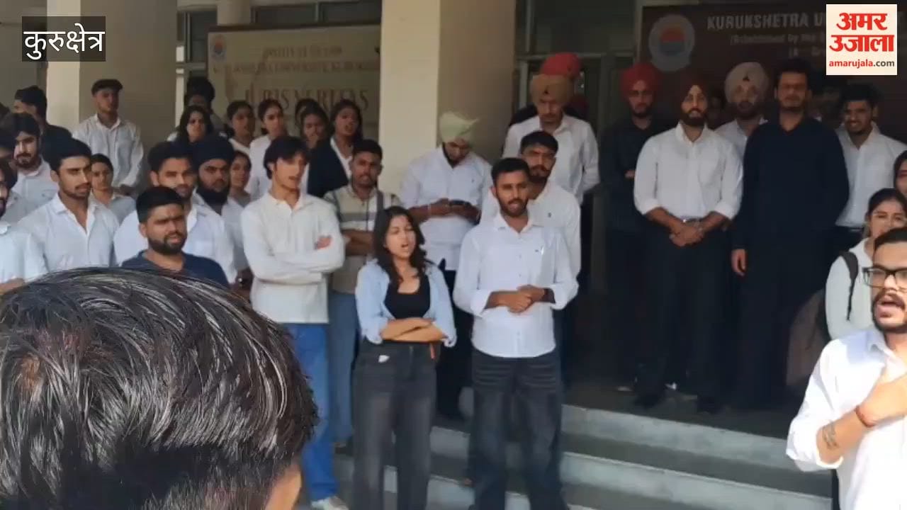 Students and teachers stage a protest at Kurukshetra University over the assault on a professor; express outrage over the lack of action.