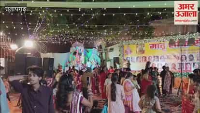 Durga Puja pandal decorated with a theme centered on Maa Vaishno Devi, featuring displays made of kidney beans (rajma) and peanuts.
