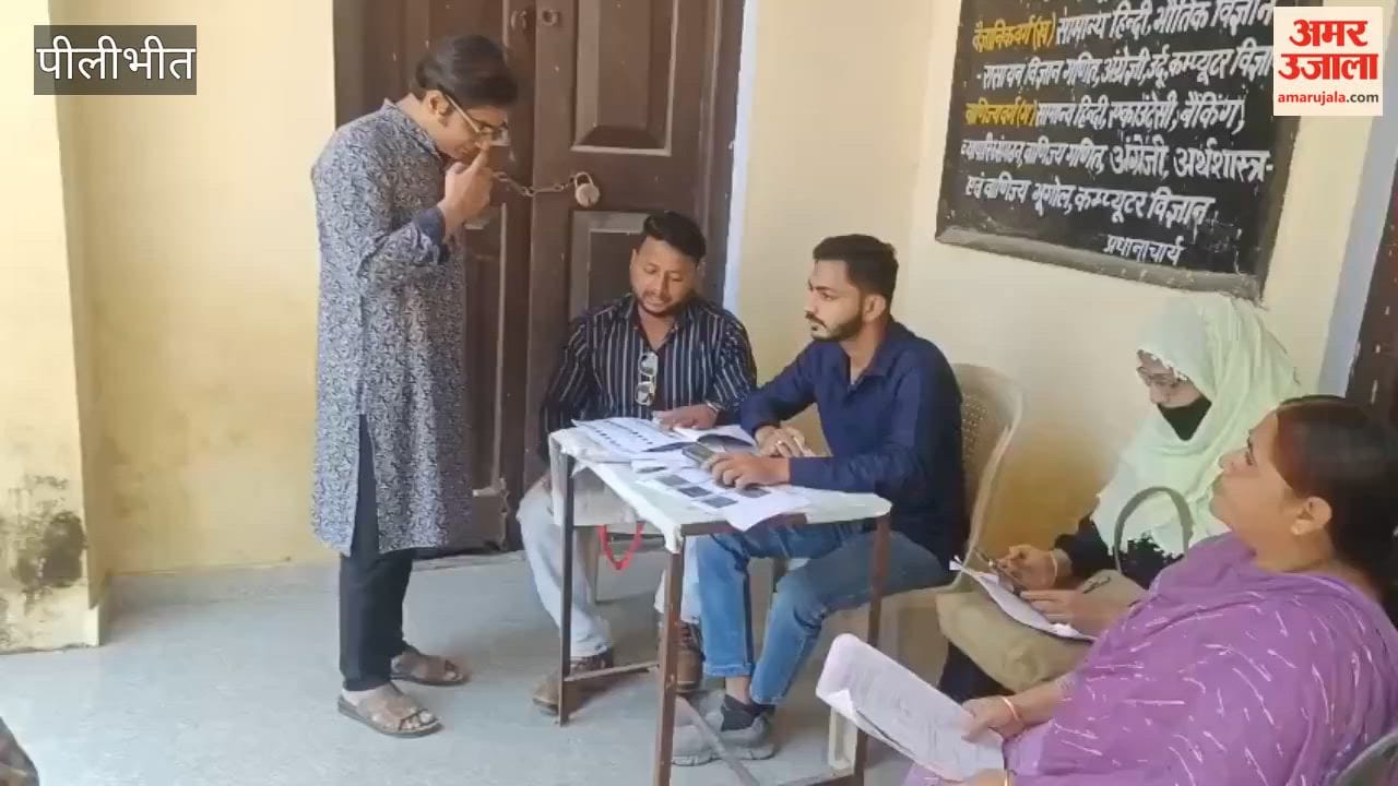 voters arrive to check the status of their details in Budaun
