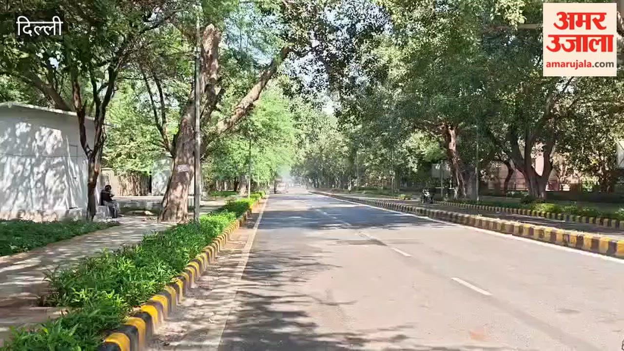 Water being sprayed from an anti-smog gun van on Mandir Marg to reduce pollution in Delhi